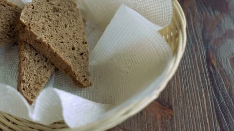 Basket with three pieces of bread Stock Footage 71840897