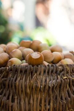 A basket of toasted hazelnuts inviting Stock Photos