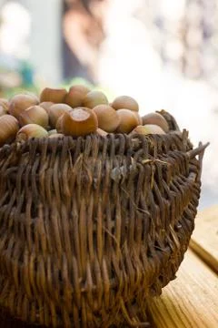A basket of toasted hazelnuts inviting Stock Photos