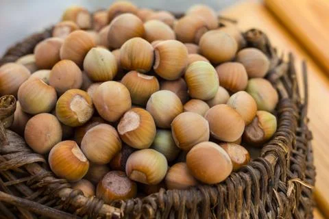 A basket of toasted hazelnuts inviting Stock-Fotos