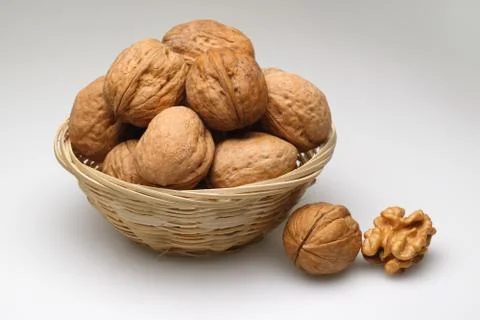 A basket of walnuts on white Stock Photos