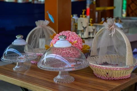 Basket with wedding gift on the table. Stock Photos