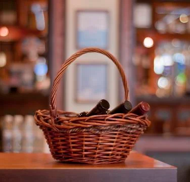 Basket with wine bottles Stock Photos