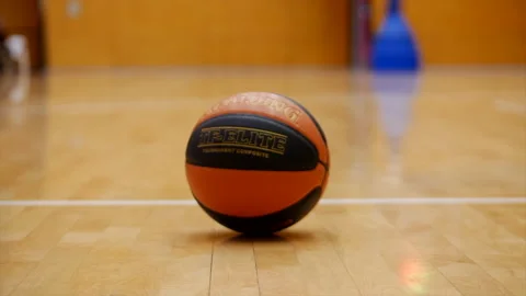 Basketball being picked up in slowmotion Stock Footage 211566354