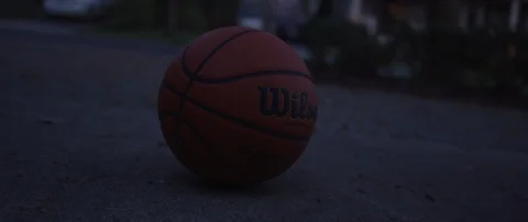 Basketball Bouncing at Night Stock Footage 129507558