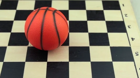 Basketball on a chessboard close up Stock Footage 78738292