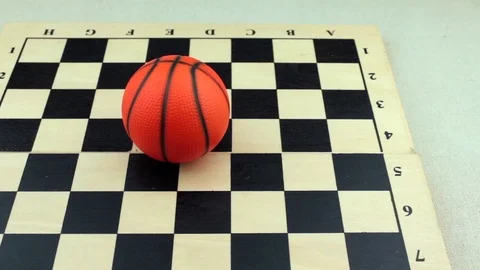 Basketball on a chessboard Stock Footage 78738321