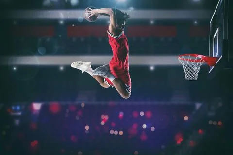 Basketball game with a high jump player to make a slam dunk to the basket Stock Photos