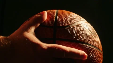 Basketball Glowing Being Placed Down and Isolated on Black, 4K Stock Footage 54170386
