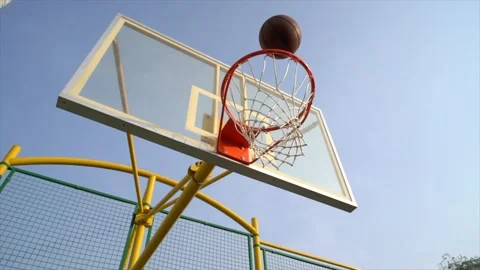 Basketball going down the hoop Video stock 137395243