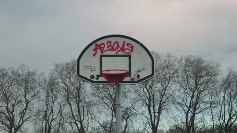 Basketball hoop graffiti'd in England, Hackney downs, london, medium shot Stock Footage 145807337