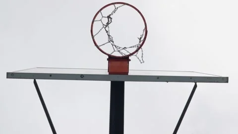 Basketball Making a Perfect Shot Through the Hoop on Outdoor Court. Capture the Stock Footage 280244154