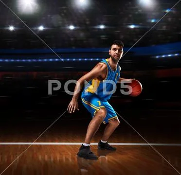 Basketball player in action on basketball playground Stock Photos