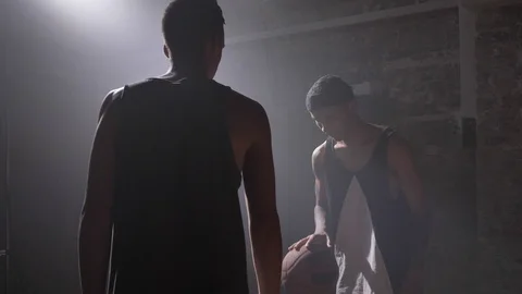 Basketball player blocking ball from another player during game, playing indoors 動画素材 93450142