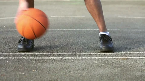 Basketball player bouncing the basketball with skill Stock Footage 34620335