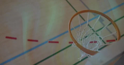 Basketball player charging exploding into dunking snapping net before rival Stock Footage 314531994