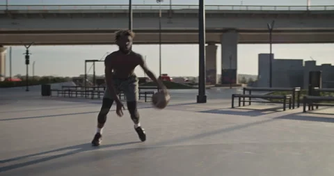 Basketball player doing tricks with ball Stock Footage 213310127