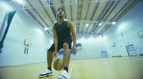 Basketball player dribbles the ball down the court Stock Footage 46202197
