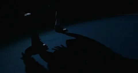 Basketball Player Dribbling while his shadow falls off his Air Jordan 1's Stock Footage 129820426