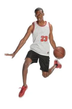Basketball player dunking ball Stock Photos