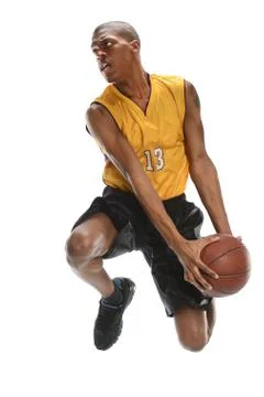 Basketball player dunking ball Stock Photos