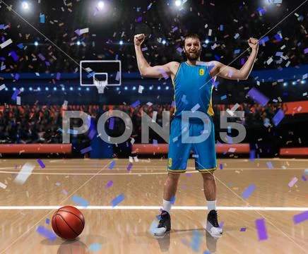 Basketball player im blue uniform standing on basketball court Stock Photos