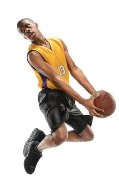 Basketball player jumping Stock Photos