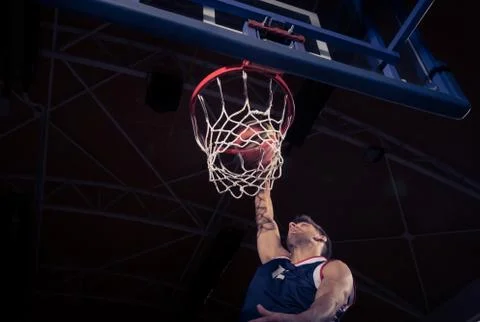 Basketball player, low angle view, slam dunk Foto stock