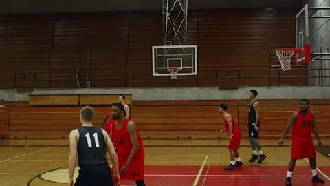 A basketball player makes a basket during a game Vídeo Stock 70681690