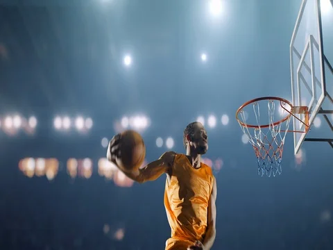 Basketball player makes a slam dunk Stock Footage 79396324
