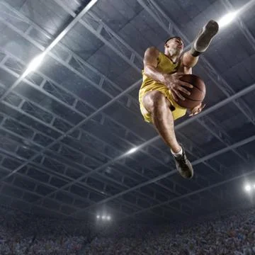 Basketball player makes slam dunk Stock Photos