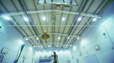 Basketball player making a 3 point jump shot in slow motion Video stock 46202251