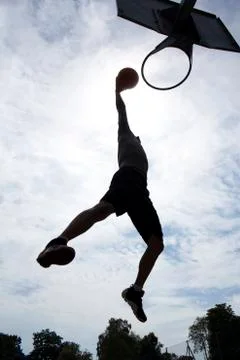 Basketball Player Slam Dunk Silhouette Stock Photos