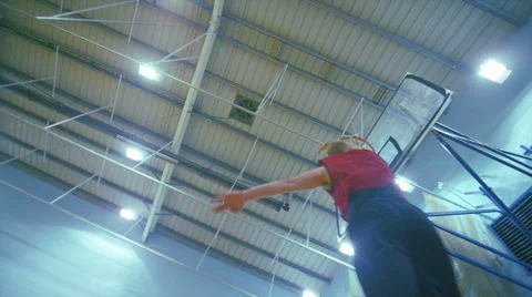 Basketball player slam dunking the ball on an indoor court Stock-Footage 44561065