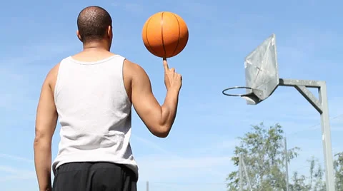 Basketball Player Spinning the Ball Stock Footage 25599331