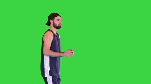Basketball player throwing the ball after getting it while walking on a Green 스톡 동영상 150387418