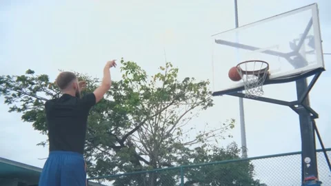 Basketball player throws the ball and scores from the second time 動画素材 236981262