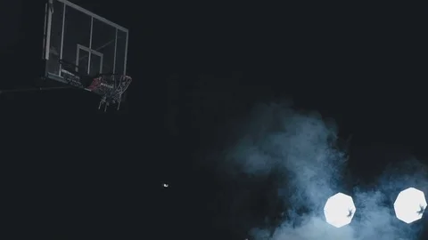 Basketball player trains in throwing a ball into the ring Stock Footage 76600643