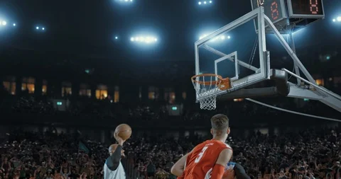 Basketball players on big professional arena during the game. Stock Footage