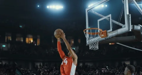 Basketball players on big professional arena during the game. Stock Footage
