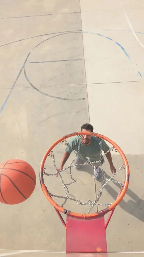 Basketball players scoring points during street game Stock Footage 304653818