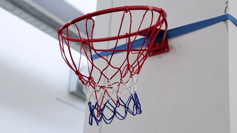 Basketball scores twice in office basket Stock Footage