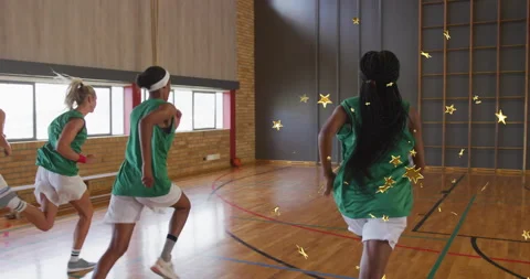 Basketball squad leaning and exploding into sprint powering across gym hardwood Stock Footage 314368084