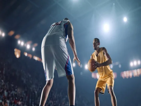 Basketball: Two opposing basketball players facing each other Stock Footage