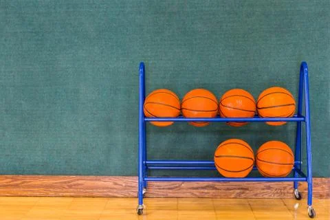 Basketballs in a Storage Rack Foto stock