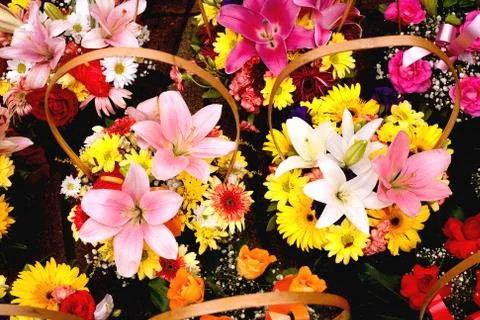 Baskets with colorful bouquets Stock Photos