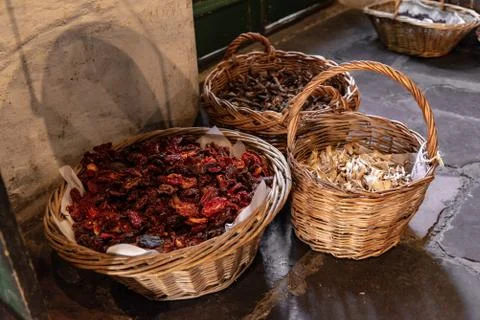 Baskets with dried aliments inside like dried tomatoes, mushrooms, raisins an Stock Photos