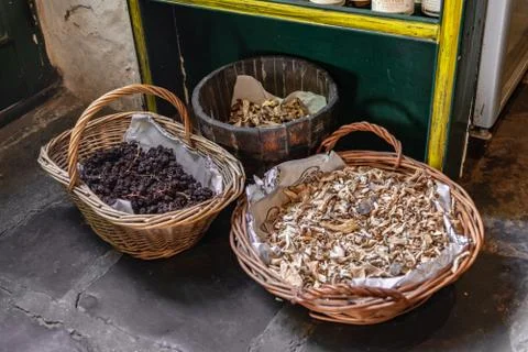 Baskets with dried aliments inside like dried tomatoes, mushrooms, raisins an Stock Photos