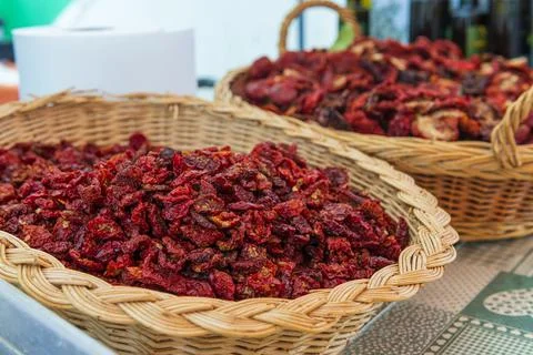 Baskets with dried tomatoes. 스톡 사진