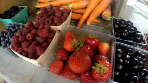Baskets of fresh fruit berries at farmers market Stock Footage 53370561